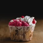 white and red heart candies on brown woven basket